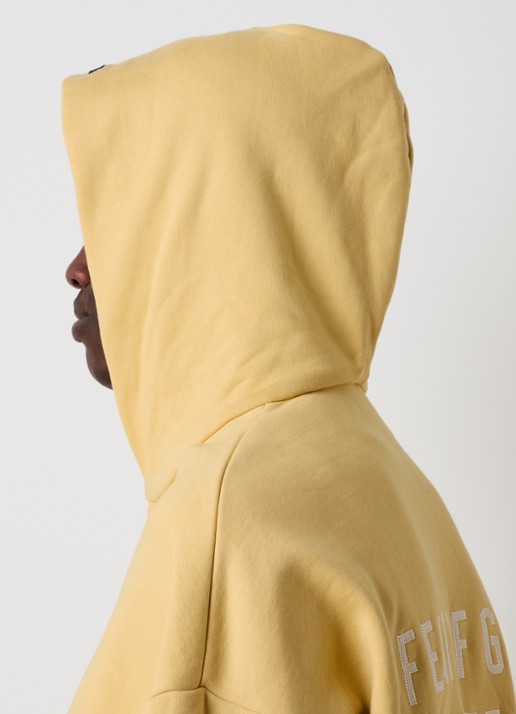 Fear of God Essentials Sweatvest met backprint en capuchon - detail 5 okergeel