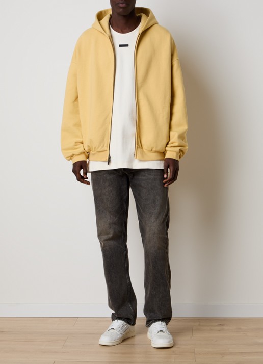 Fear of God Essentials Sweatvest met backprint en capuchon - voorkant 2 okergeel