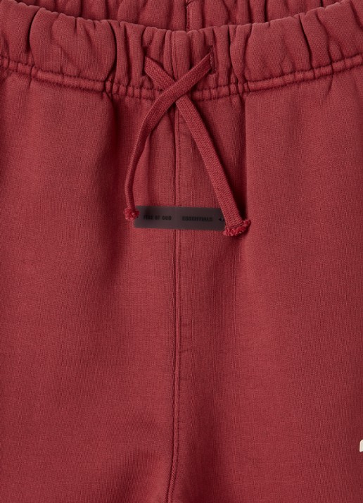 Fear of God Essentials Tapered fit joggingbroek met logo - detail steenrood