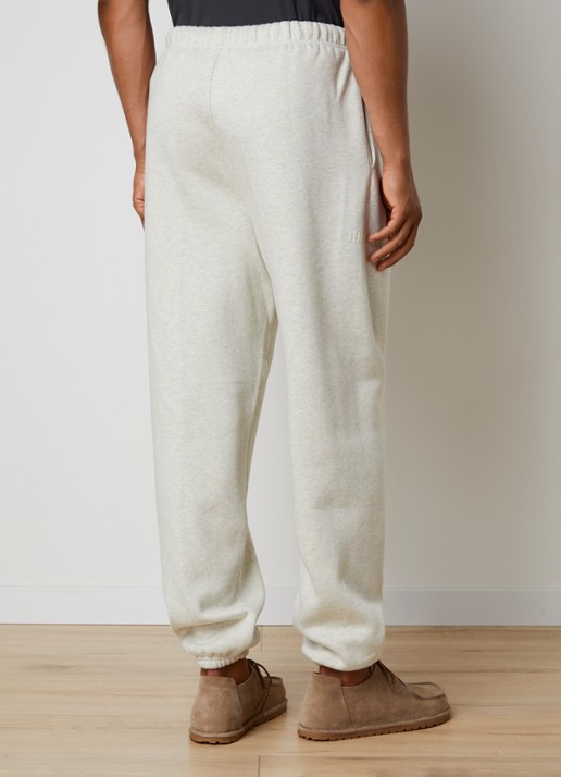 Fear of God Essentials Tapered fit joggingsbroek met steekzakken - achterkant gebroken wit