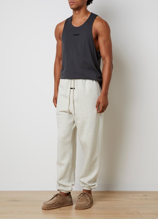 Fear of God Essentials Tapered fit joggingsbroek met steekzakken - voorkant 3 gebroken wit