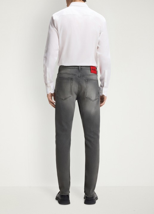 HUGO Slim fit jeans met gekleurde wassing - achterkant grijs