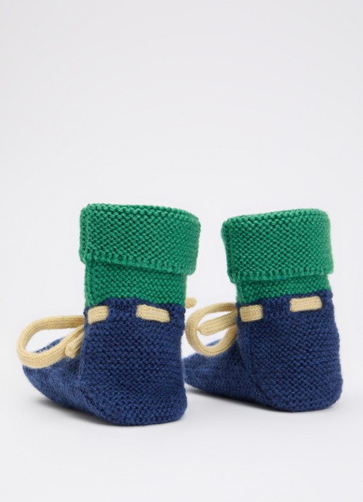 Hvid Babyslofjes van merino wol  - achterkant donkerblauw