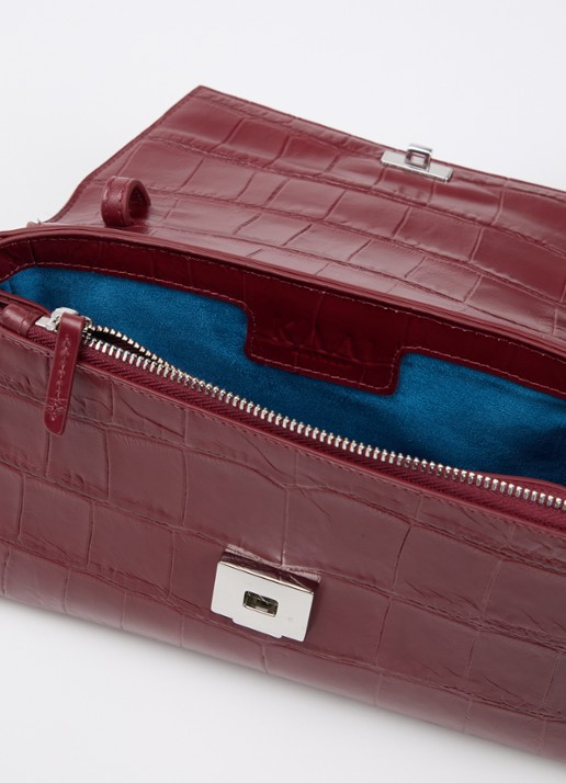 KAAI Ikon clutch van leer met afneembare schouderriem - detail bordeauxrood