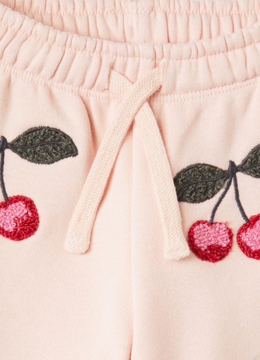 Konges Sløjd Lou tapered fit joggingbroek met borduring - detail zalmroze