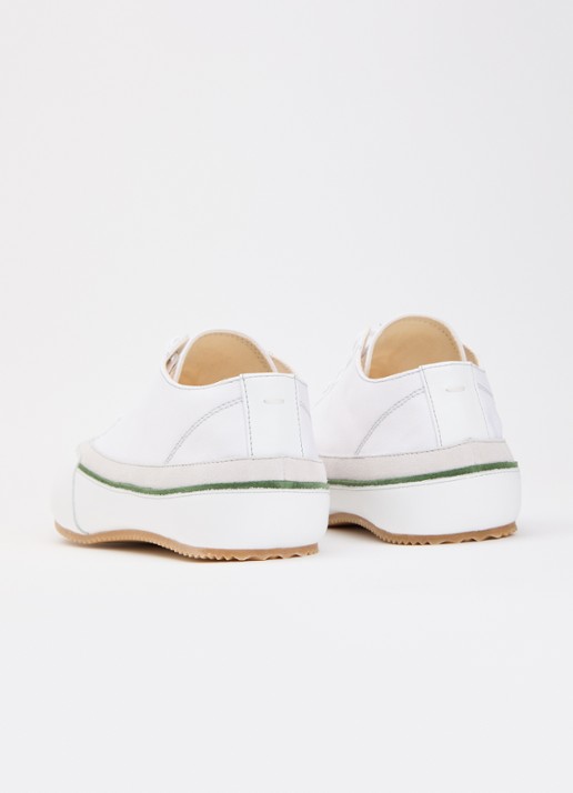 Maison Margiela Traveler sneaker van canvas met kalfsleren details - achterkant gebroken wit