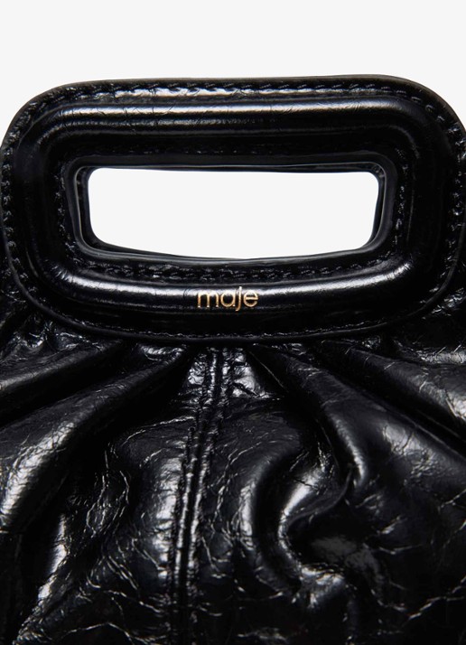 Maje Clutch van leer met afneembare schouderriem - detail 4 zwart