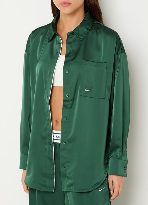 Nike Blouse van satijn met borstzak en logo