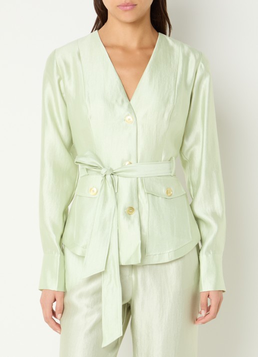 NIKKIE Porlamar blouse met metallic finish en strikdetail