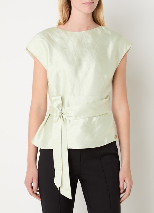 NIKKIE Porlamar top met metallic finish en strikdetail