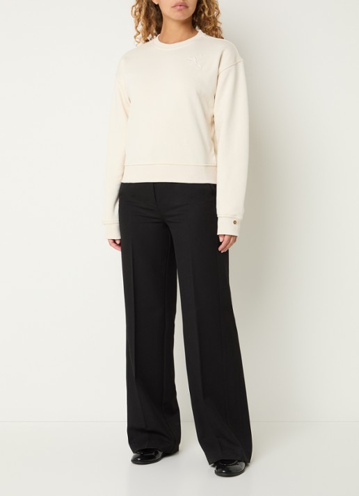 NIKKIE Swirl sweater met logoborduring - voorkant 2 creme