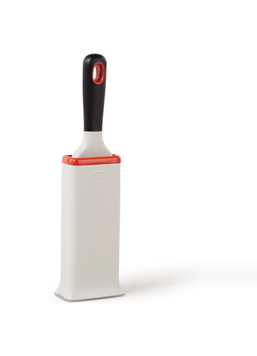 Oxo Good Grips pluizenborstel met houder