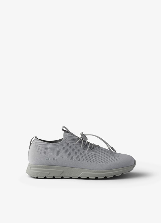Prada Prax sneaker met gebreid bovenwerk - voorkant grijs