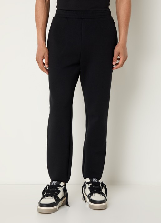 Represent 247 Numbers tapered fit joggingsbroek met logo en steekzakken - detail zwart