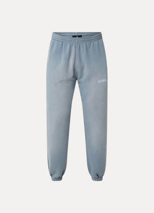 Represent Patron Of The Club tapered fit joggingbroek met verwassen afwerking en steekzakken - voorkant staalblauw