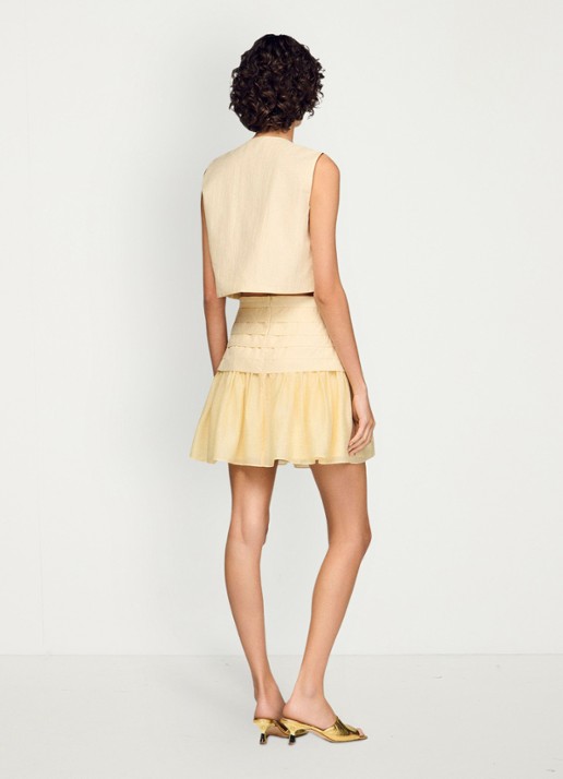 Sandro Mini rok met plooien - achterkant vanilla / geel