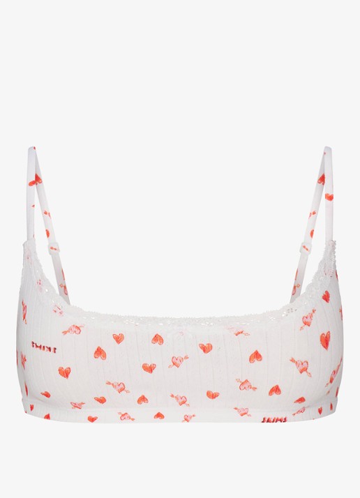 SKIMS Lightweight Cotton Pointelle bralette met print - voorkant snow arrowed hearts