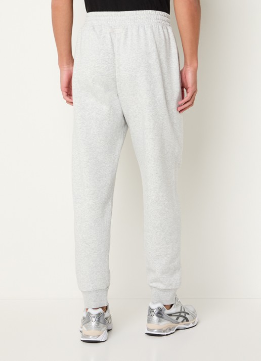 SKIMS Tapered fit joggingbroek met steekzakken - achterkant light heather grey