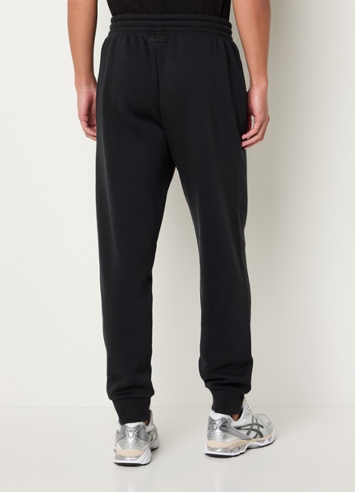 SKIMS Tapered fit joggingbroek met steekzakken - achterkant 9 washed onyx