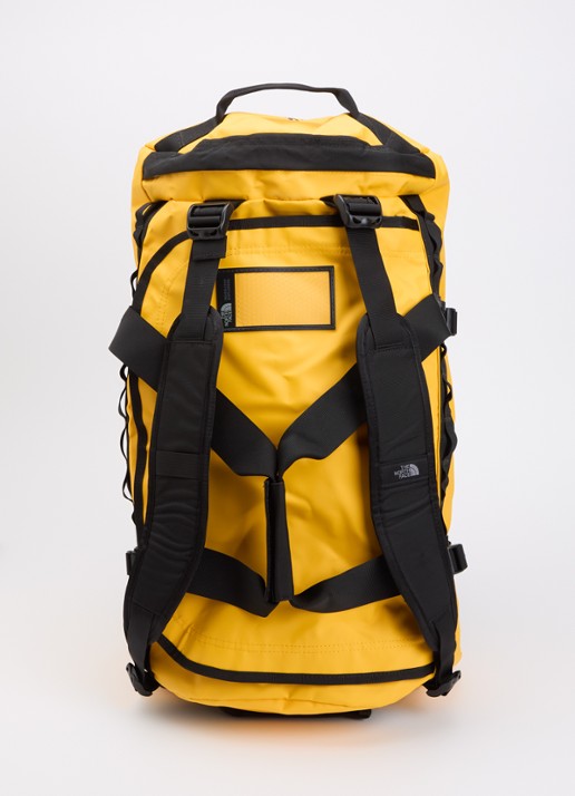 The North Face Base Camp Duffel M weekendtas met verstelbare schouderriem - achterkant geel