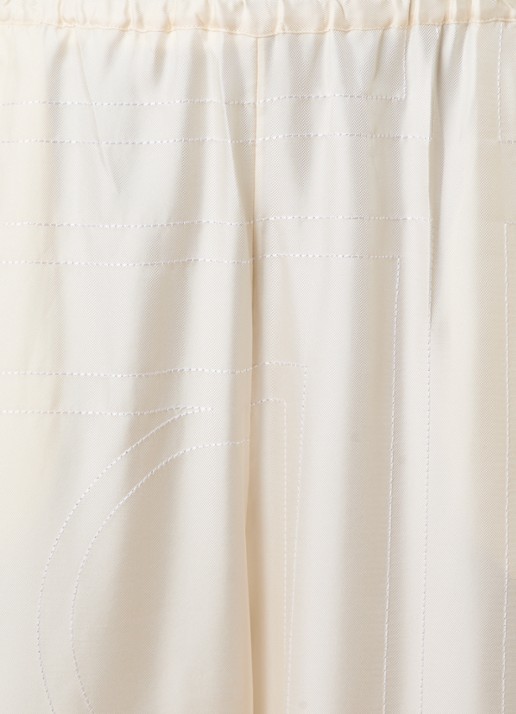 TOTEME Monogram low waist wide fit broek van zijde met logoborduring - detail 4 gebroken wit