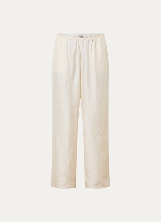 TOTEME Monogram low waist wide fit broek van zijde met logoborduring - voorkant gebroken wit