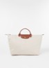 Le Pliage reistas L met leren details - Creme