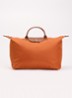 Le Pliage reistas L met leren details - Oranjebruin